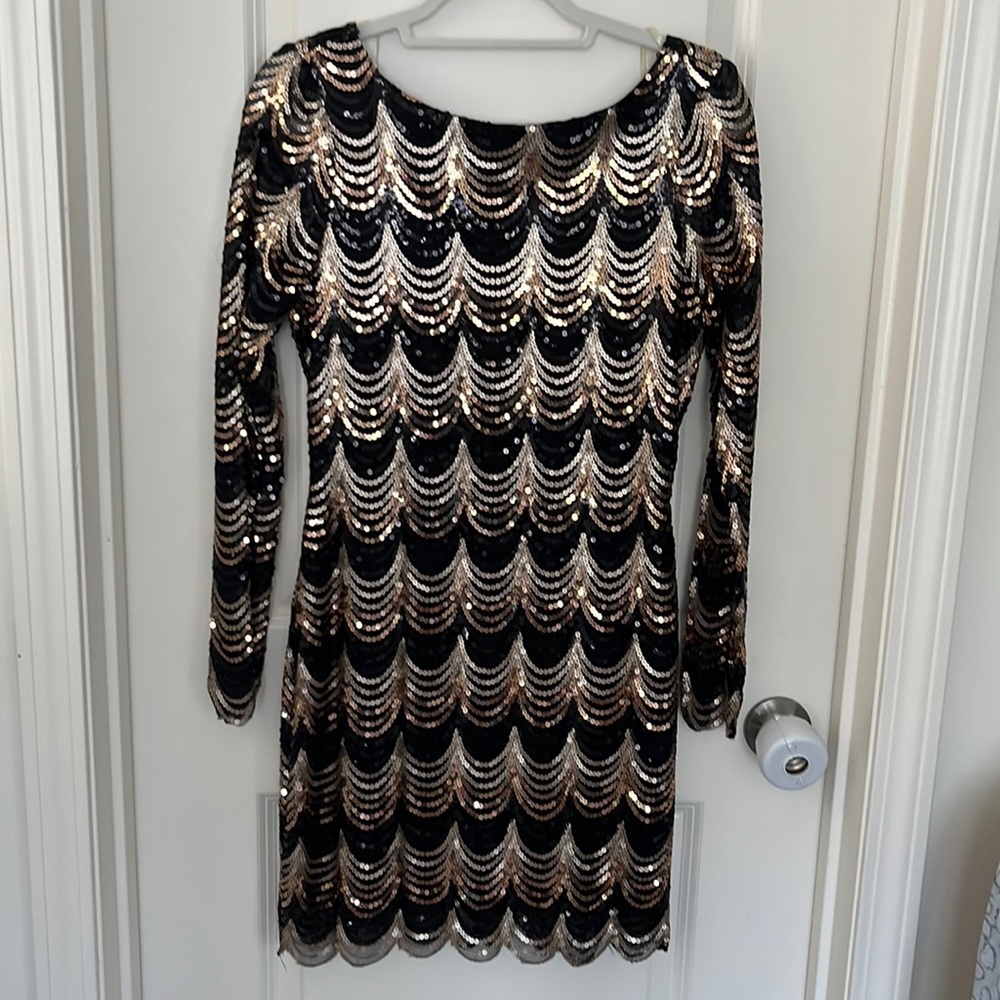 Beautiful black and gold sequience fitted dress